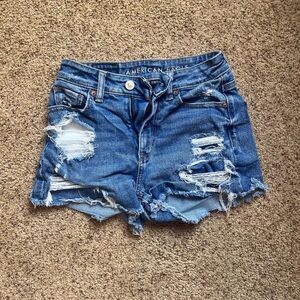 Blue ripped stretch jean shorts. American Eagle. 000.